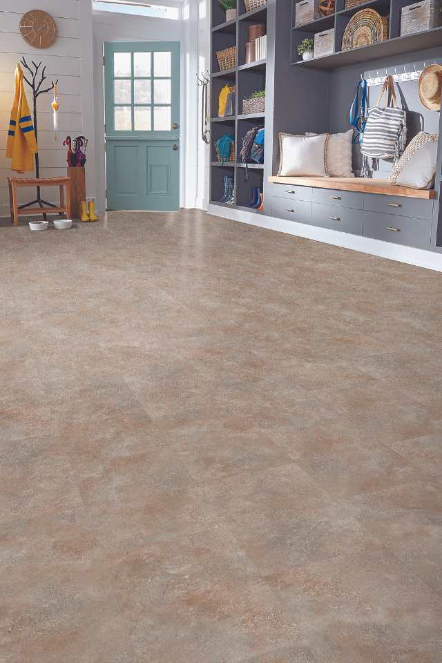 stone look luxury vinyl tile in modern home entryway with bench and shelving